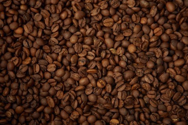 A detailed view of freshly roasted coffee beans showcasing texture and color.